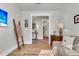 Entryway into living space featuring wood flooring and view of adjoining rooms at 302 Autumn Azalea Way, Summerville, SC 29486