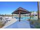 Poolside cabana with wood frame and lounge chairs at Latitude Margaritaville Watersound at 302 Autumn Azalea Way, Summerville, SC 29486