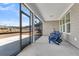 Enclosed back porch featuring blue outdoor chairs, offering a relaxing outdoor living space at 302 Autumn Azalea Way, Summerville, SC 29486