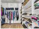 Walk-in closet featuring built-in shelving and ample storage space for clothes and shoes at 302 Autumn Azalea Way, Summerville, SC 29486