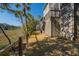 A backyard with a wooden fence, grass, and marsh views at 308 Jungle Rd, Edisto Beach, SC 29438