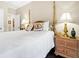 Bedroom with four-poster bed, side table and two lamps at 308 Jungle Rd, Edisto Beach, SC 29438