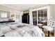 Bedroom with a sliding glass door to a deck and a black dresser with a television at 308 Jungle Rd, Edisto Beach, SC 29438
