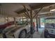 A spacious carport provides sheltered parking for multiple vehicles, and includes a golf cart at 308 Jungle Rd, Edisto Beach, SC 29438