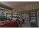 A spacious carport provides sheltered parking for multiple vehicles, with stairs and a door visible at 308 Jungle Rd, Edisto Beach, SC 29438
