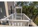 Outdoor elevator provides convenience and accessibility to the upper levels, with a view to the treeline at 308 Jungle Rd, Edisto Beach, SC 29438