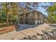 Charming home with a spacious driveway, garage, and stairs leading to the porch at 308 Jungle Rd, Edisto Beach, SC 29438