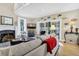 Bright living room with modern furniture, fireplace, and sliding doors leading to outdoor space at 308 Jungle Rd, Edisto Beach, SC 29438