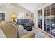 Living room with vaulted ceilings, a ceiling fan and furniture seating at 308 Jungle Rd, Edisto Beach, SC 29438