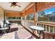 Covered porch with comfortable seating and a view at 308 Jungle Rd, Edisto Beach, SC 29438