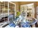Cozy screened-in porch with wicker seating, offering a relaxing view and seamless indoor-outdoor transition at 308 Jungle Rd, Edisto Beach, SC 29438
