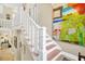 Staircase with white banister and painted walls at 308 Jungle Rd, Edisto Beach, SC 29438