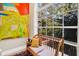 Window seat with bright painting, throw pillows and hardwood floors at 308 Jungle Rd, Edisto Beach, SC 29438