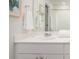 Bathroom features a shower-tub combo, framed art, and a sink with white cabinetry at 317 Pine Crest View, Summerville, SC 29486