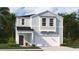 Charming two-story home with light-blue siding, white trim, a dark front door, and an attached garage at 317 Pine Crest View, Summerville, SC 29486