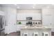 Modern kitchen boasts stainless steel appliances, granite countertops, and a convenient center island at 317 Pine Crest View, Summerville, SC 29486