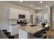 Well-equipped kitchen with stainless steel appliances, granite countertops, and a functional island with bar stools at 319 Pine Crest View, Summerville, SC 29486