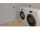 A clean and functional laundry area equipped with high-end appliances, ready for efficient washing at 319 Pine Crest View, Summerville, SC 29486