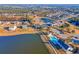 Community aerial view, highlighting the swimming pool, pond with fountain, and various houses at 3278 Great Egret Dr, Johns Island, SC 29455