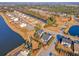An aerial view of the neighborhood with a large pond near several homes at 3278 Great Egret Dr, Johns Island, SC 29455