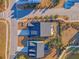 Aerial view of houses with a lawn and a view of a pond at 3278 Great Egret Dr, Johns Island, SC 29455