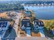 Aerial view showcasing a neighborhood with lake access, community pool, and well-maintained homes at 3278 Great Egret Dr, Johns Island, SC 29455