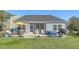 Well-kept backyard with a patio, hot tub, and lush green lawn at 3278 Great Egret Dr, Johns Island, SC 29455