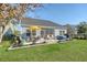 Inviting backyard with outdoor dining and entertainment area with a hot tub at 3278 Great Egret Dr, Johns Island, SC 29455