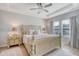 Relaxing bedroom with a decorative bed, matching bedside tables, and lots of natural light at 3278 Great Egret Dr, Johns Island, SC 29455