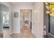 Welcoming home entryway featuring wood flooring, neutral walls, and decor leading to the bedroom and living spaces at 3278 Great Egret Dr, Johns Island, SC 29455