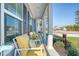 Cozy front porch featuring comfortable seating, stylish accents, and views of the manicured front yard at 3278 Great Egret Dr, Johns Island, SC 29455