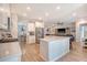 Bright kitchen with stainless steel appliances and an island open to the living room at 3278 Great Egret Dr, Johns Island, SC 29455