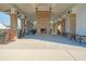 Elegant open-air pavilion with a brick fireplace, rocking chairs, and tables for community use at 3278 Great Egret Dr, Johns Island, SC 29455