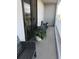 Cozy balcony with outdoor seating and potted plant, offering a peaceful retreat for enjoying fresh air at 330 Concord St # 4C, Charleston, SC 29401