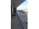 Spacious balcony with white railings and neighborhood views, an inviting space for outdoor relaxation at 330 Concord St # 4C, Charleston, SC 29401