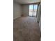 Airy bedroom featuring plush carpeting, a large window, and access to a private balcony with scenic views at 330 Concord St # 4C, Charleston, SC 29401