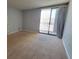 Spacious bedroom with large window and balcony access, offering abundant natural light and outdoor views at 330 Concord St # 4C, Charleston, SC 29401