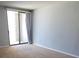 Light-filled bedroom with sliding glass door and neutral walls, creating a serene and inviting atmosphere at 330 Concord St # 4C, Charleston, SC 29401