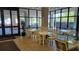 Inviting dining area with lots of natural light, bright furniture, and charming decor at 330 Concord St # 4C, Charleston, SC 29401
