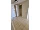 Tiled entryway with coat closet and white entry door for a clean and bright welcome to the home at 330 Concord St # 4C, Charleston, SC 29401