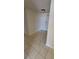 An interior view showing the neutral tiled entryway and front door of unit at 330 Concord St # 4C, Charleston, SC 29401