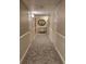 Hallway with neutral carpet and wall colors and contemporary decorations at 330 Concord St # 4C, Charleston, SC 29401