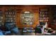 Charming library with wooden bookshelves, comfortable seating, and sophisticated decor at 330 Concord St # 4C, Charleston, SC 29401