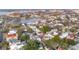 An aerial view of a home with a black arrow on the roof near a body of water and lush greenery at 4 Trapman St # A, Charleston, SC 29401
