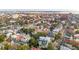 Aerial view of a home with a black arrow on the roof in a neighborhood with lush trees and skyline views at 4 Trapman St # A, Charleston, SC 29401