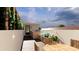 Outdoor roof deck featuring a dining area, planters, privacy fencing, and a private entry at 4 Trapman St # A, Charleston, SC 29401