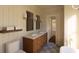 Modern bathroom featuring dual sinks, sconces and a separate toilet area for added privacy at 4 Trapman St # B, Charleston, SC 29401