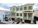 Charming new construction townhouse with green shutters, garage, and beautifully landscaped front yard at 4 Trapman St # B, Charleston, SC 29401