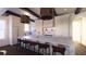 Bright kitchen featuring a large island with seating, modern stainless steel appliances, and a large window at 4 Trapman St # B, Charleston, SC 29401