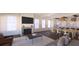 Cozy living room featuring a fireplace, large windows, and an open floor plan with a dining table at 4 Trapman St # B, Charleston, SC 29401